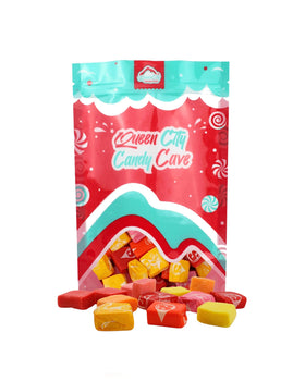 QUEEN CITY CANDY CAVE Original Star Candy orange-wrapped, ideal for celebrations.