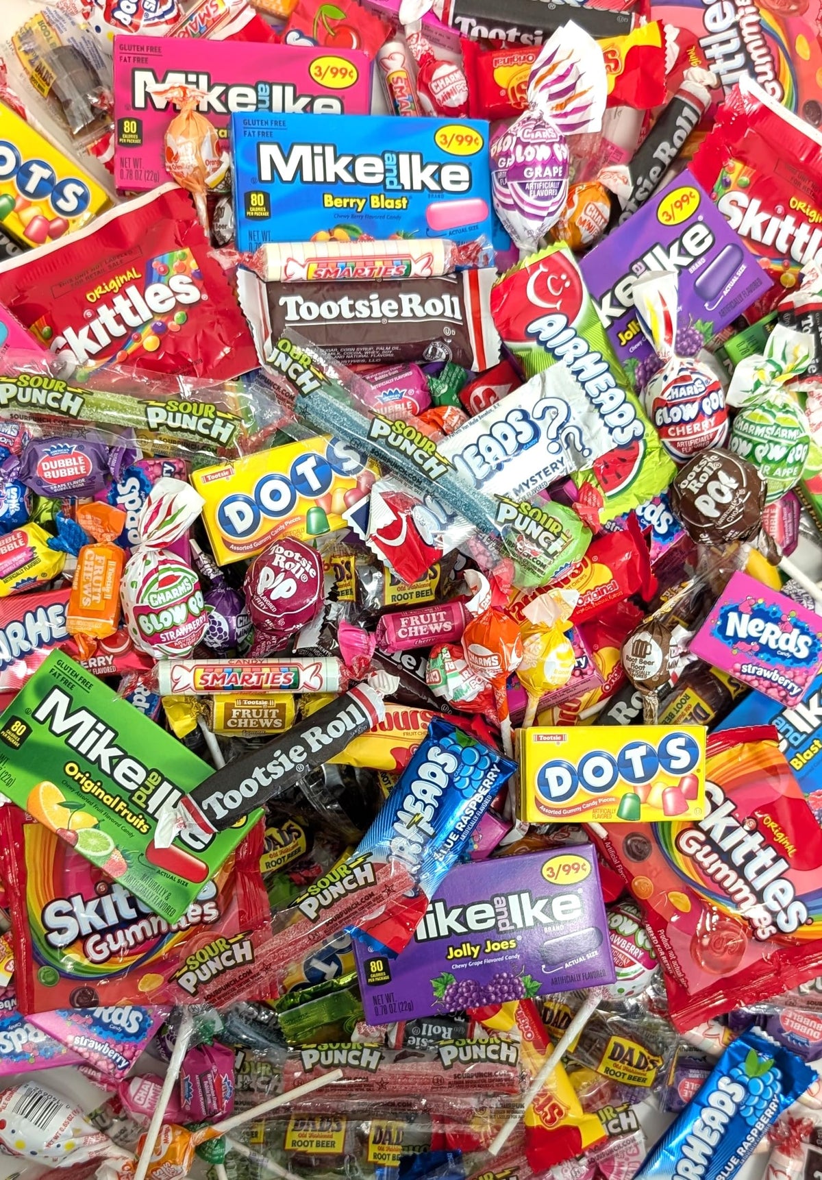 QUEEN JAX candy assortment spilling from bulk bag, ideal for party favors