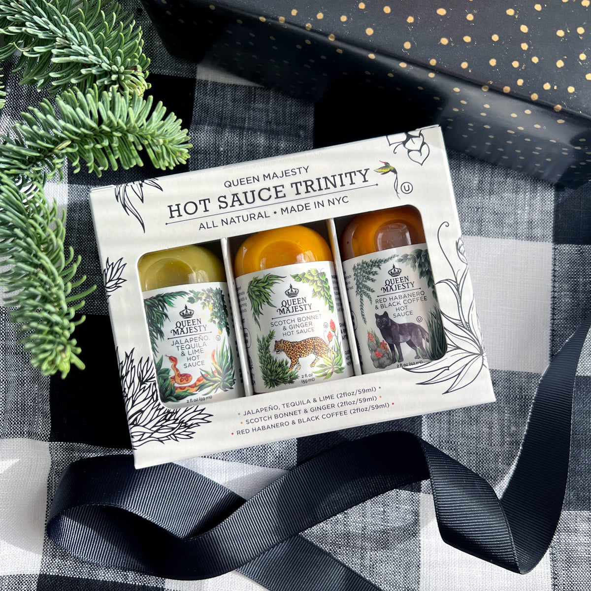 Tasting set display with Queen Majesty sauces in a trio