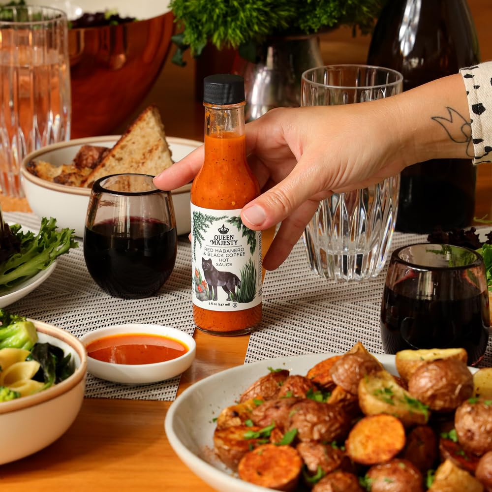 Queen Majesty hot sauce label closeup showcases artisanal ingredients and fair trade ethos