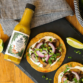 Fresh jalapeños, lime, and garlic visible in Queen Majesty ingredients for all-natural depth.