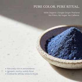 Close-up of Queen Omi butterfly pea tea powder texture and vivid color.