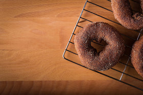 Rabbit Creek Apple Cider Donuts dusting sugar ready to finish with sweetness