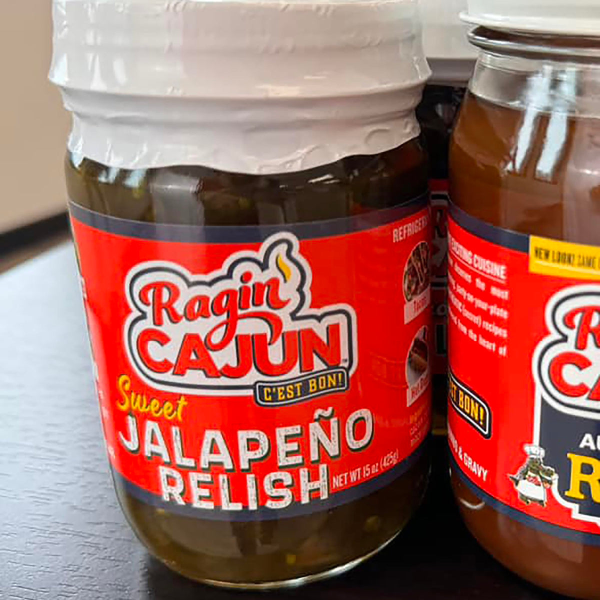 Relish being spooned onto a burger for extra kick