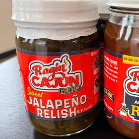 Relish being spooned onto a burger for extra kick