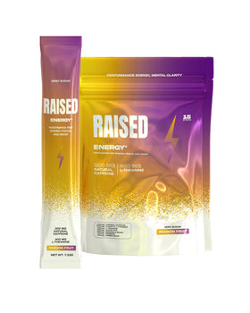 Raised Energy+ stick pack poured into water for a quick pick-me-up.