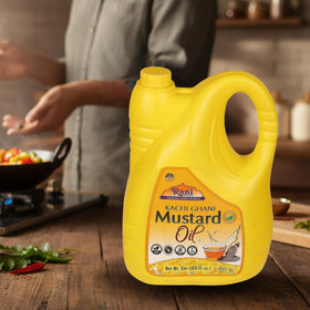 Rani Brand Mustard Oil glass bottle on kitchen counter