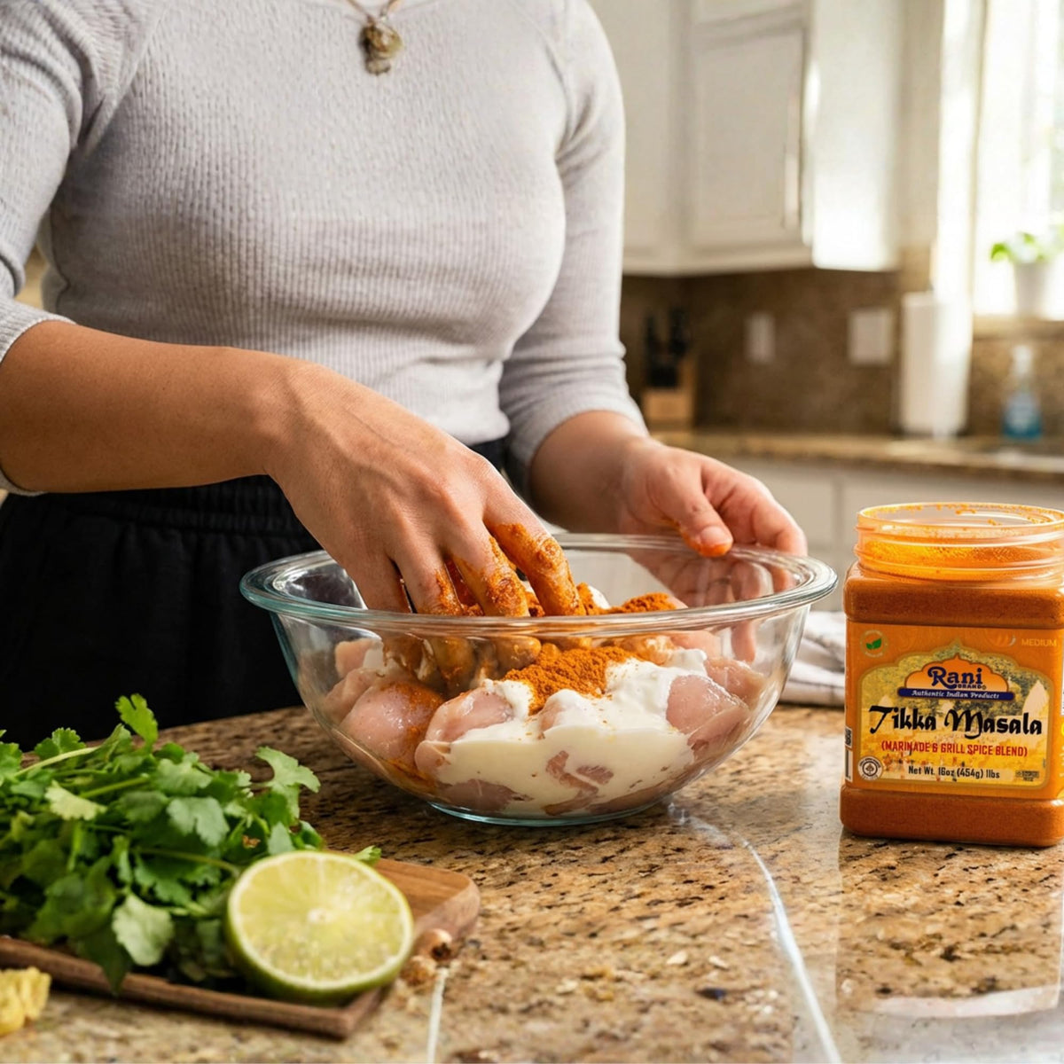 Pouring Rani Tikka Masala spice blend adds bold flavor to marinades.