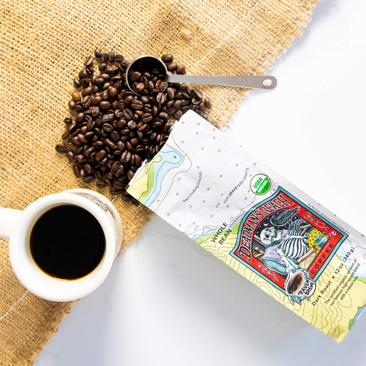 Raven’s Brew Deadman’s Reach whole beans on a kitchen counter