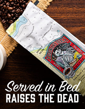 Raven's Brew Deadman's Reach ground coffee shows a deep roast for a smooth cup.