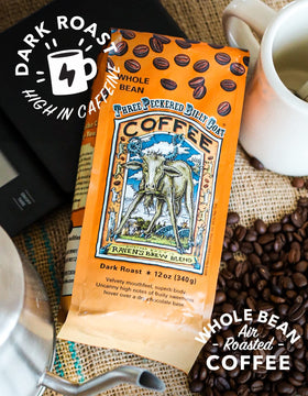 Raven's Brew Three Peckered Billy Goat coffee beans close-up highlighting premium origin flavor.