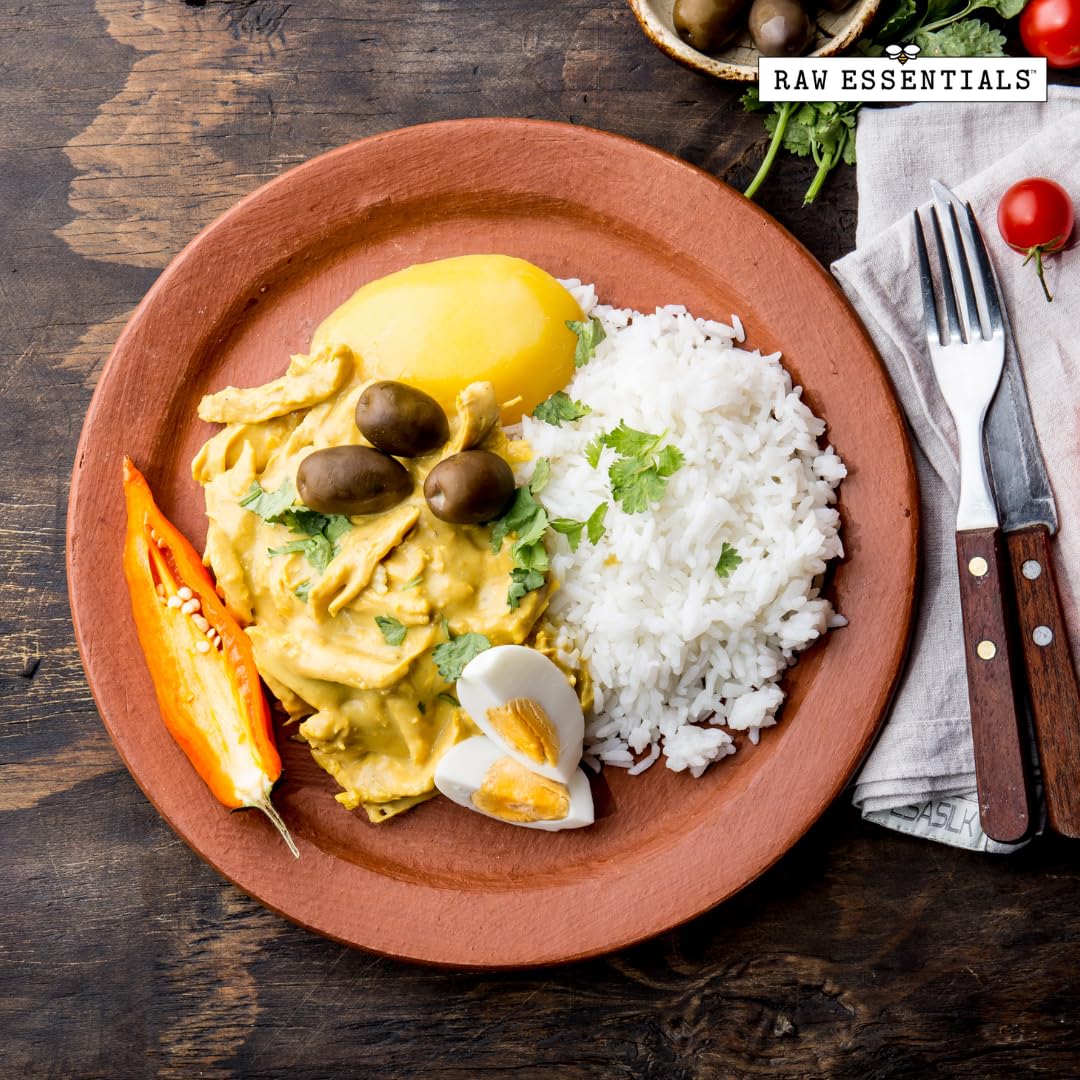 Raw Essentials Aji Amarillo Powder sprinkled over rice showcases versatile everyday use.