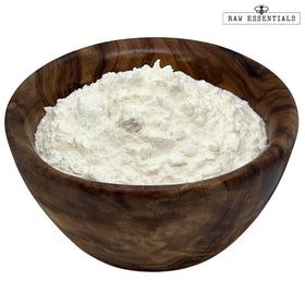 Raw Essentials Asiago Cheese Powder dusted over pasta for creamy depth