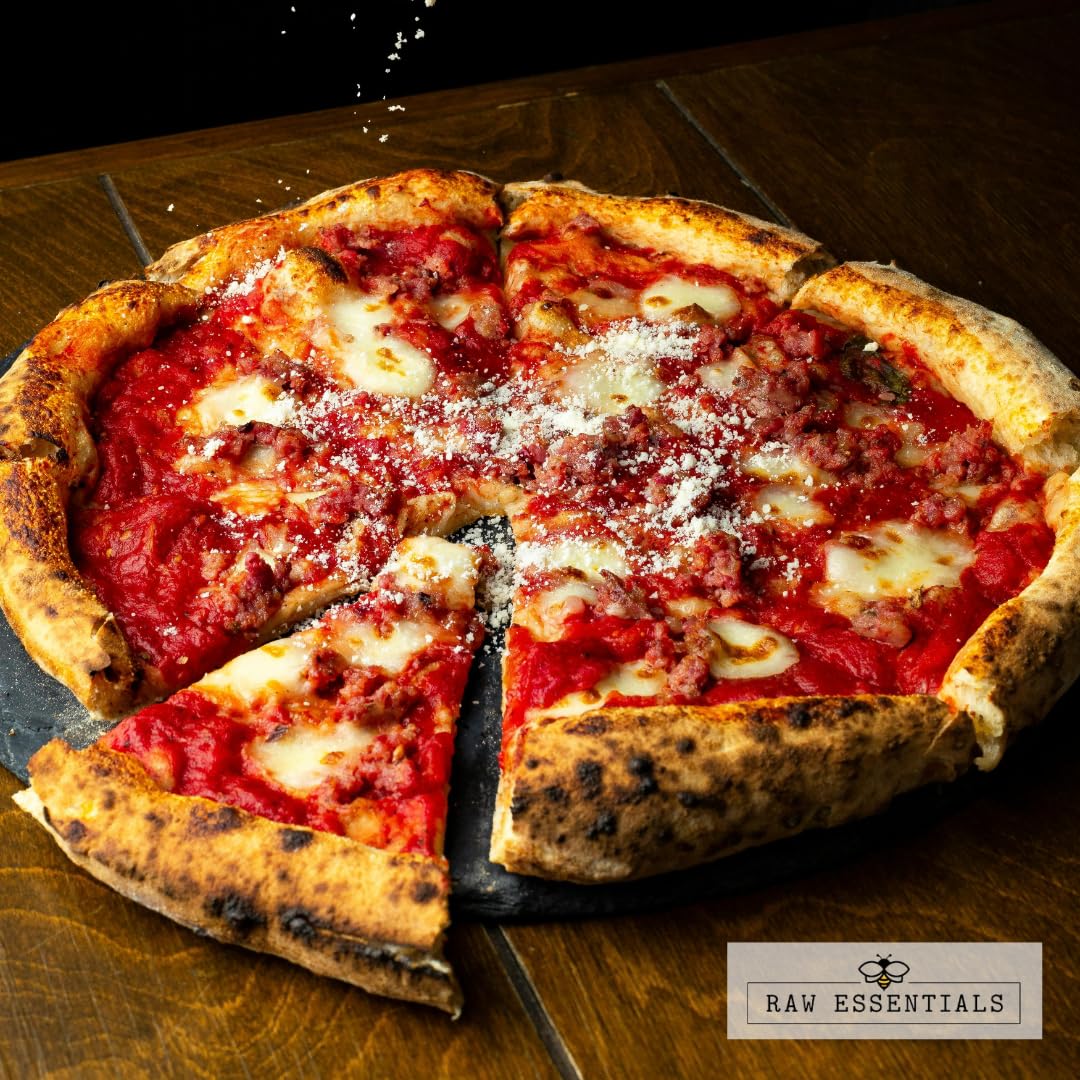 Raw Essentials Asiago Cheese Powder sprinkled on pizza for savory depth