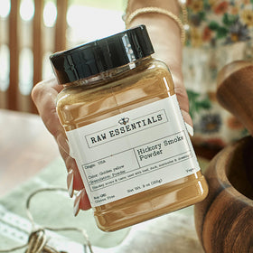 Kitchen scene featuring Raw Essentials Hickory Smoke Powder jar