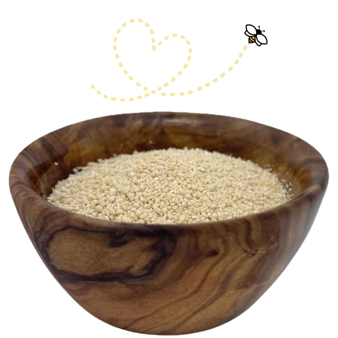 Raw Essentials Honey Granules being scooped from the jar for tea or coffee