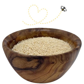 Raw Essentials Honey Granules being scooped from the jar for tea or coffee