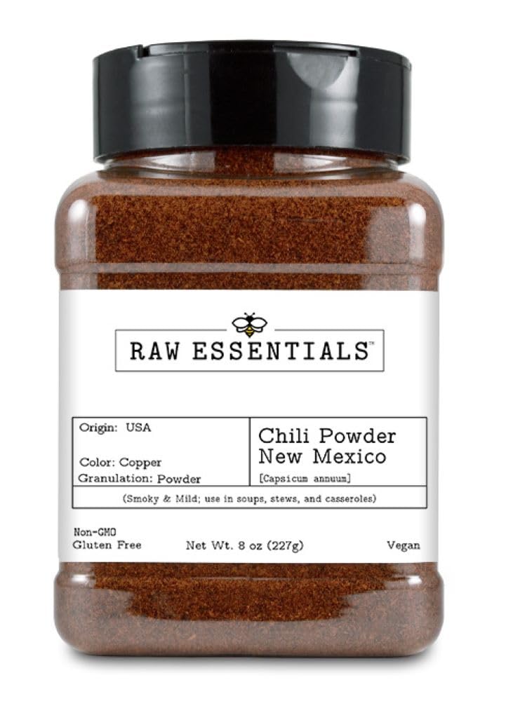 Raw Essentials New Mexico Red Chili Powder bottle closeup showing smoky, mild flavor for everyday cooking.