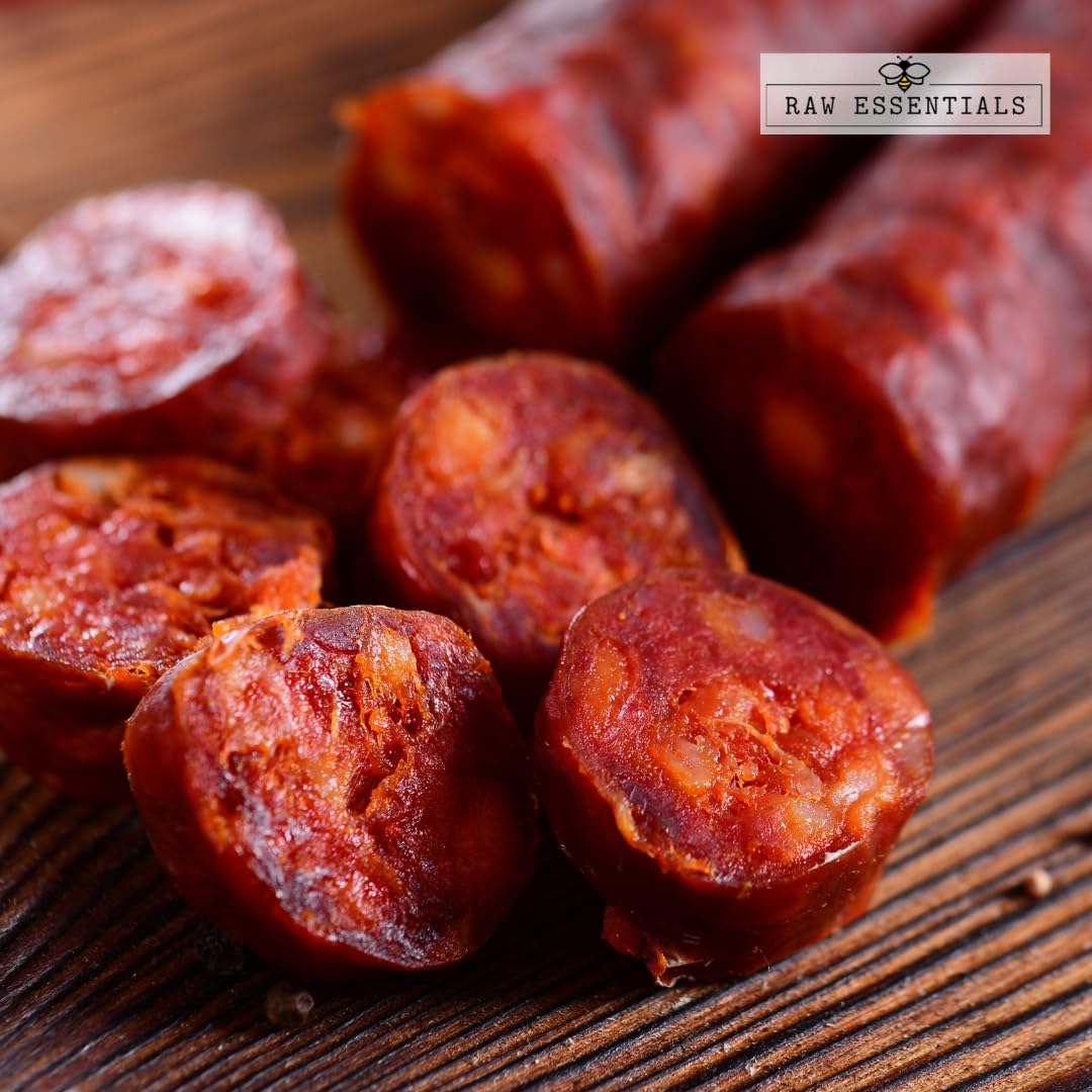 Raw Essentials smoked paprika powder rub tray reveals deep red hue for flavorful rubs.