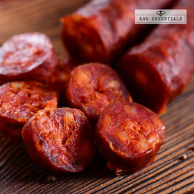 Raw Essentials smoked paprika powder rub tray reveals deep red hue for flavorful rubs.