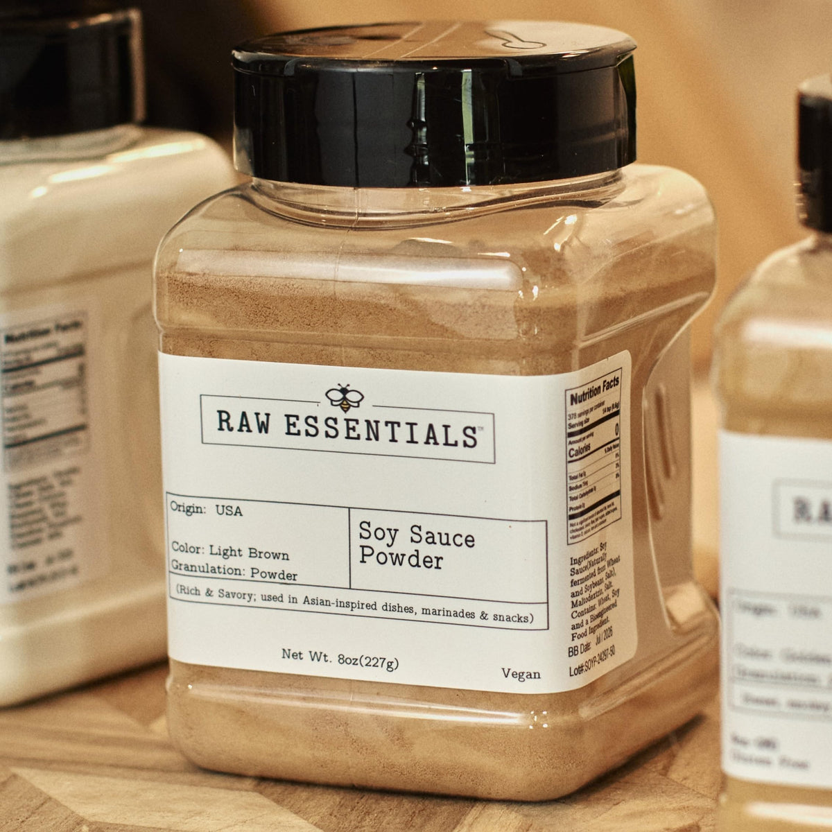 Raw Essentials Soy Sauce Powder packaging highlights shelf-stable vegan ingredient