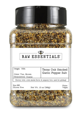 Raw Essentials Texas Pit Oak Smoked Garlic Pepper Salt bottle pour for rich barbecue flavor.