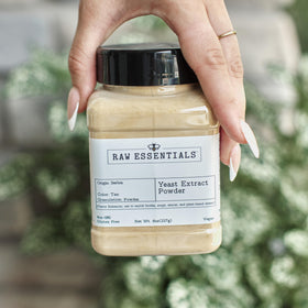 Raw Essentials yeast extract powder packaging and measuring scoop shown for precise dosing.