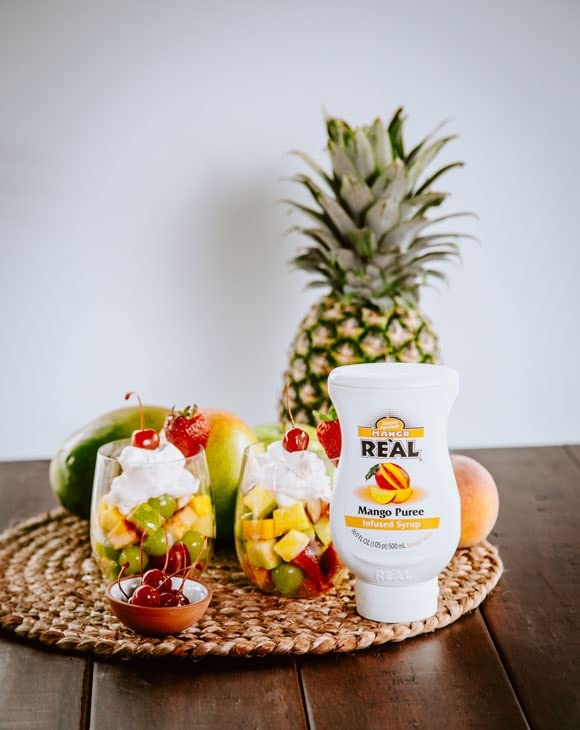 Reàl Infused Exotics pina bottle pour captures tangy pineapple notes for tropical sips.