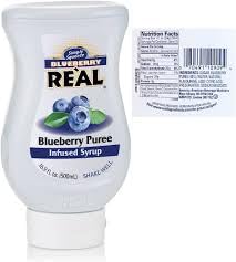 REAL Blueberry Real Infused Exotics bottle highlights premium blueberries for cocktails and desserts.