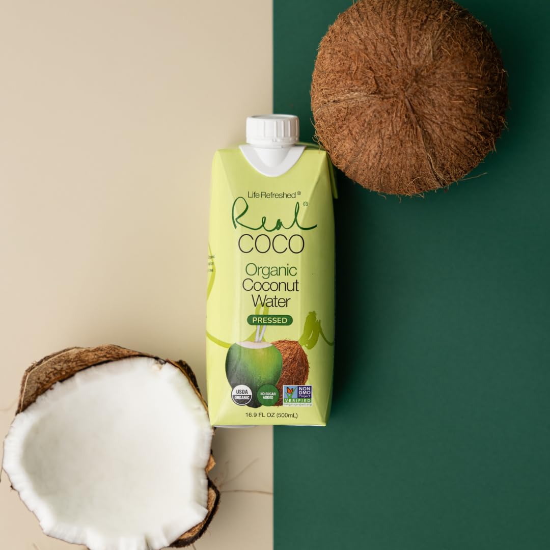 Real Coco pouring coconut water into a glass, silky stream.