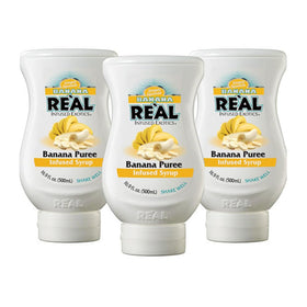 Reàl Infused Exotics banana puree syrup bottle front for tropical drinks