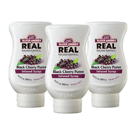Reàl Infused Exotics black cherry puree syrup bottle front highlights versatile flavor for beverages.