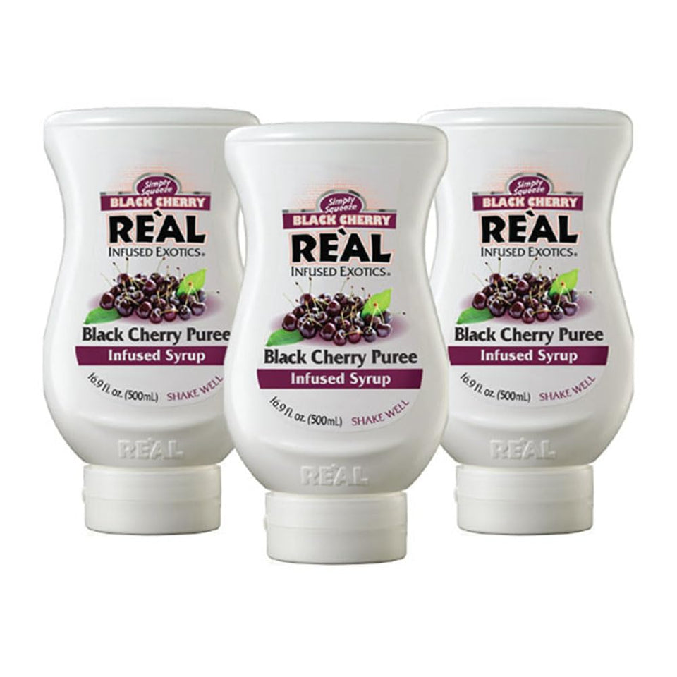Reàl Infused Exotics black cherry puree syrup bottle front highlights versatile flavor for beverages.