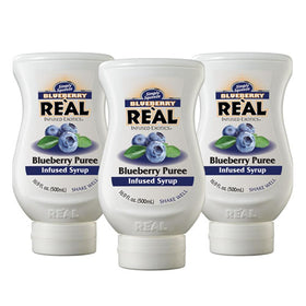 Reàl Infused Exotics blueberry puree syrup bottle front, ideal for vibrant cocktails