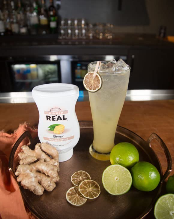 Reàl Infused Exotics Ginger Syrup wide-mouth opening for easy access with a bar spoon.