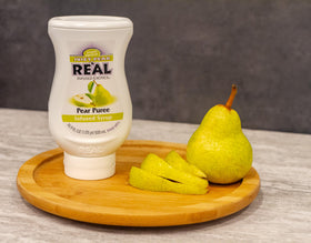 Reàl Infused Exotics Juicy Pear syrup drizzled over ice cream for dessert flair.
