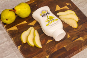 Reàl Infused Exotics Juicy Pear syrup in a vibrant mocktail, a tasty non-alcoholic option.