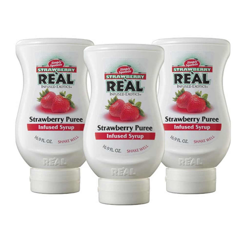 Reàl Infused Exotics Strawberry Puree bottle closeup for versatile cocktails.
