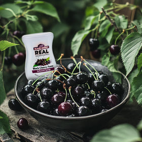 Reàl Infused Exotics volcano spout dispensing supports clean, drip-free mixing.