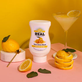Real Infused Exotics Yuzu citrus blend in glass captures vibrant aroma for mocktails