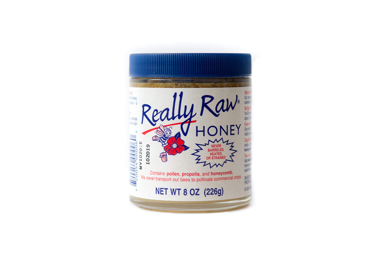 Really Raw Honey bottle front shows rich amber color ideal for toast and tea.