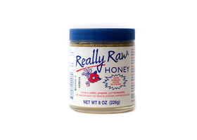 Really Raw Honey bottle front shows rich amber color ideal for toast and tea.