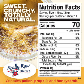 Really Raw Honey jar closeup reveals natural sediment and pollen for authentic flavor.