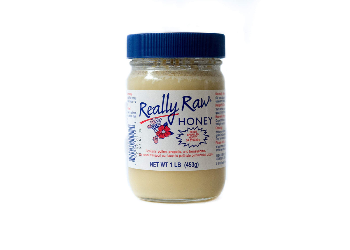 Really Raw Honey jar front with wildflower aroma, ideal for tea.