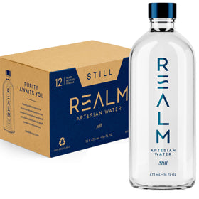REALM Artesian Water 16oz glass bottle front view for everyday hydration.