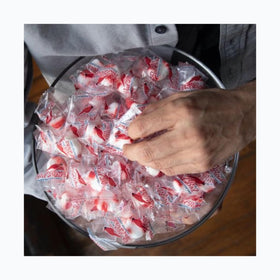 Hand-applied red stripe on Red Bird peppermint candy puffs