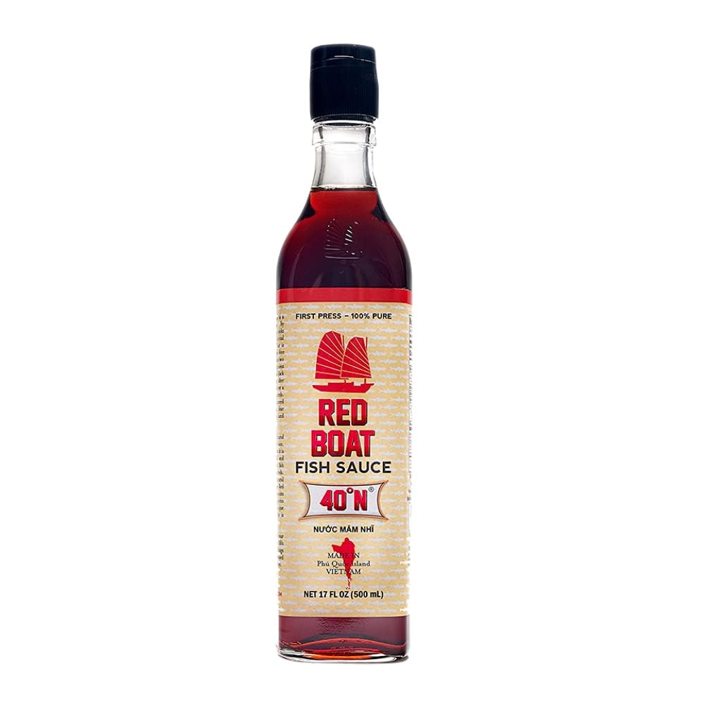 Red Boat Fish Sauce bottle closeup highlighting pure flavor and premium quality.