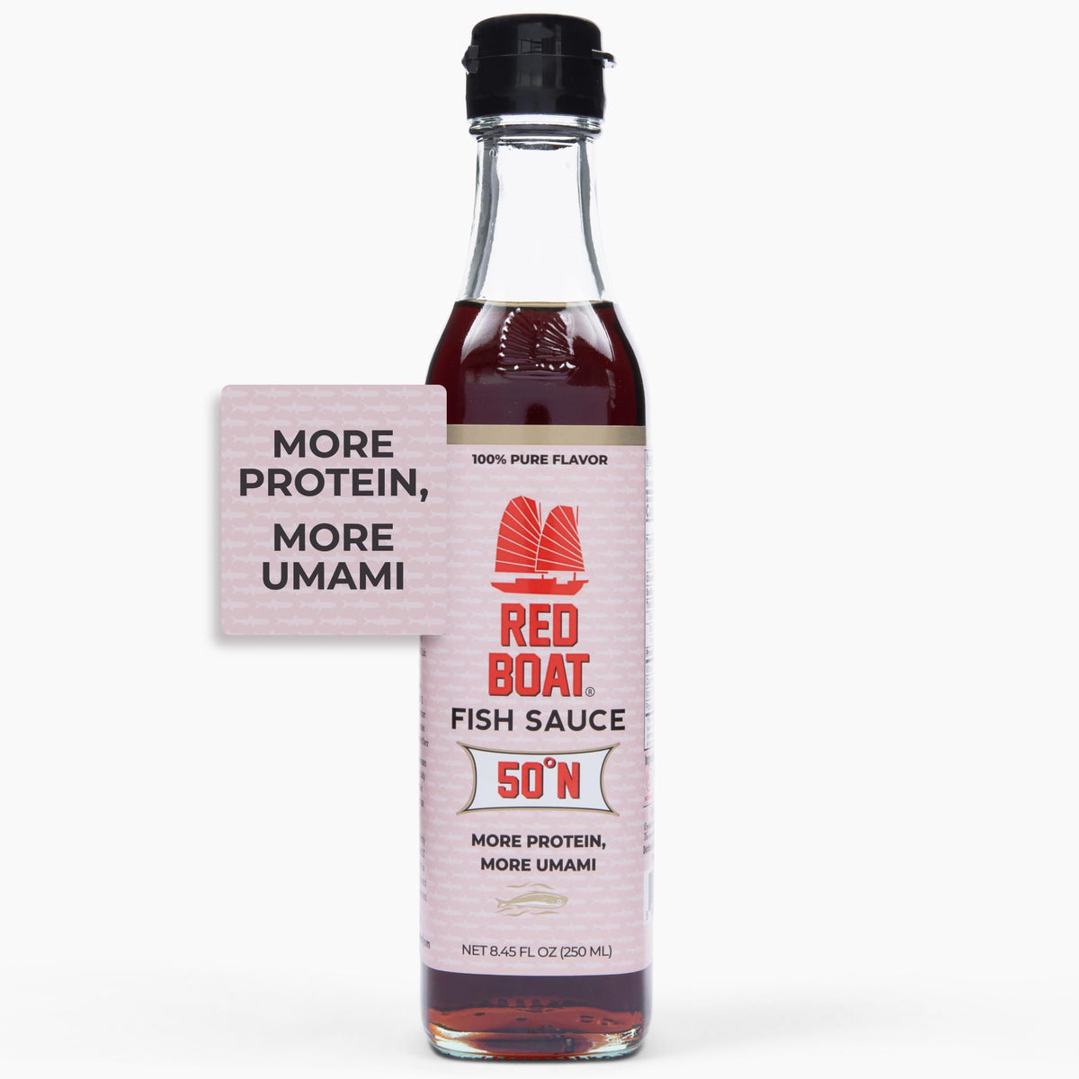 Red Boat Phamily Reserve bottle pouring, enhancing sauces with rich umami.