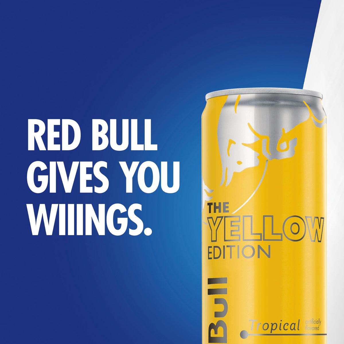 Tilted Red Bull Yellow Edition Tropical can for quick energy on the move.