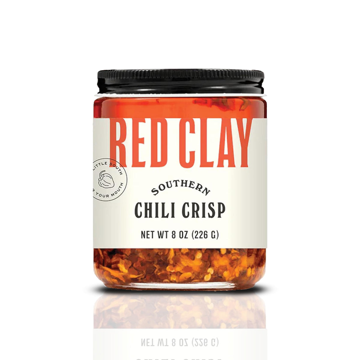 Red Clay Chili Crisp bottle on counter adding savory heat to meals